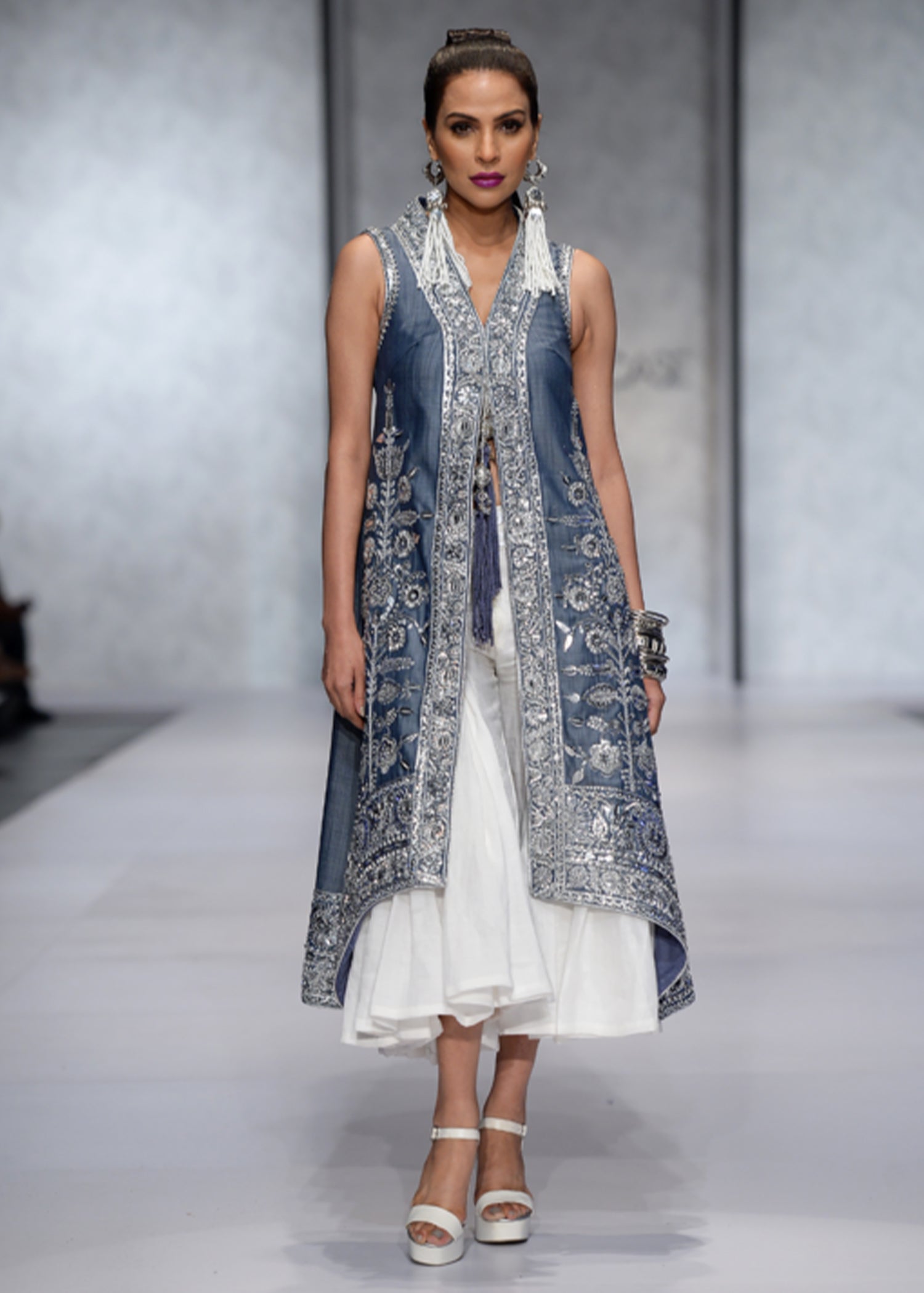 Sleeveless Long Coat with Silver-work, paired with a Lehenga